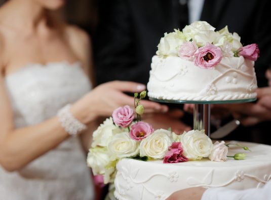 Weddings bride cutting cake